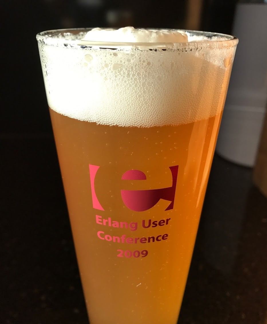 A beer
  glass with an Erlang logo.